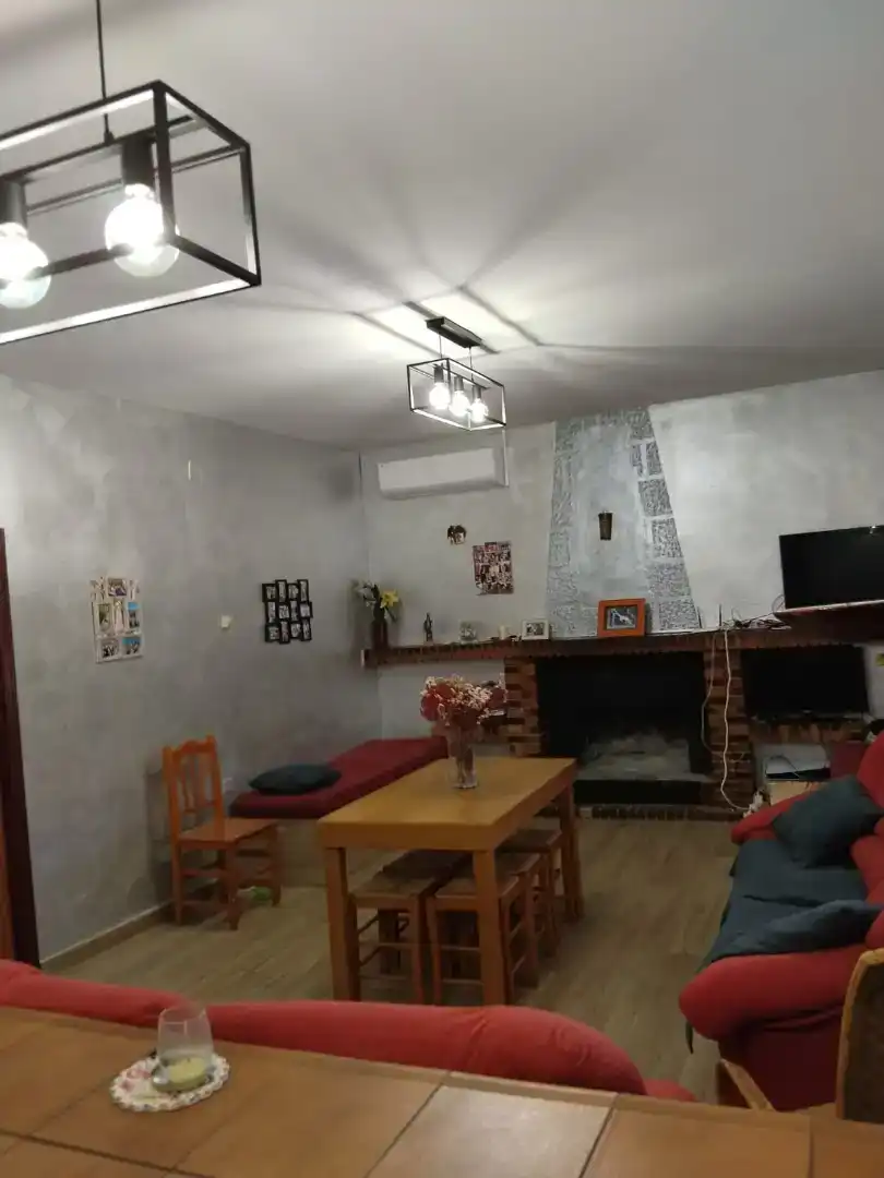 Sala d'estar de Casa o xalet en venda en Membrilla amb Aire condicionat, Jardí privat i Parquet