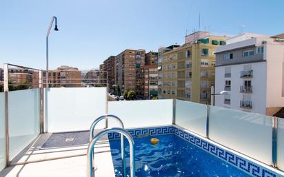 Swimming pool of Single-family semi-detached for sale in  Granada Capital  with Air Conditioner, Heating and Terrace