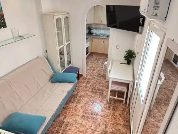 Sala d'estar de Casa adosada en venda en Algarrobo amb Aire condicionat, Terrassa i Balcó