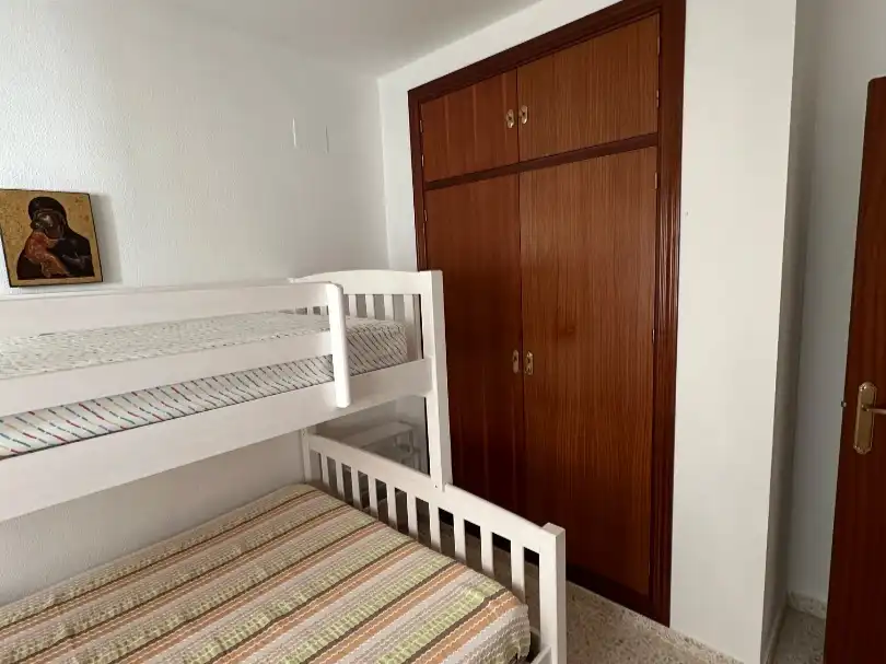 Habitación de Apartamento de alquiler en El Portil con Jardín privado, Terraza y Piscina
