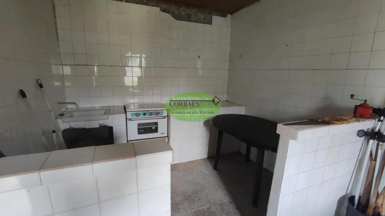 Cuina de Casa o xalet en venda en Cortegada amb Jardí privat