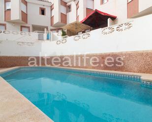 Swimming pool of Single-family semi-detached for sale in La Nucia  with Air Conditioner, Terrace and Balcony