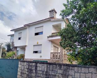 Vista exterior de Casa o xalet en venda en Sanxenxo amb Calefacció, Jardí privat i Terrassa