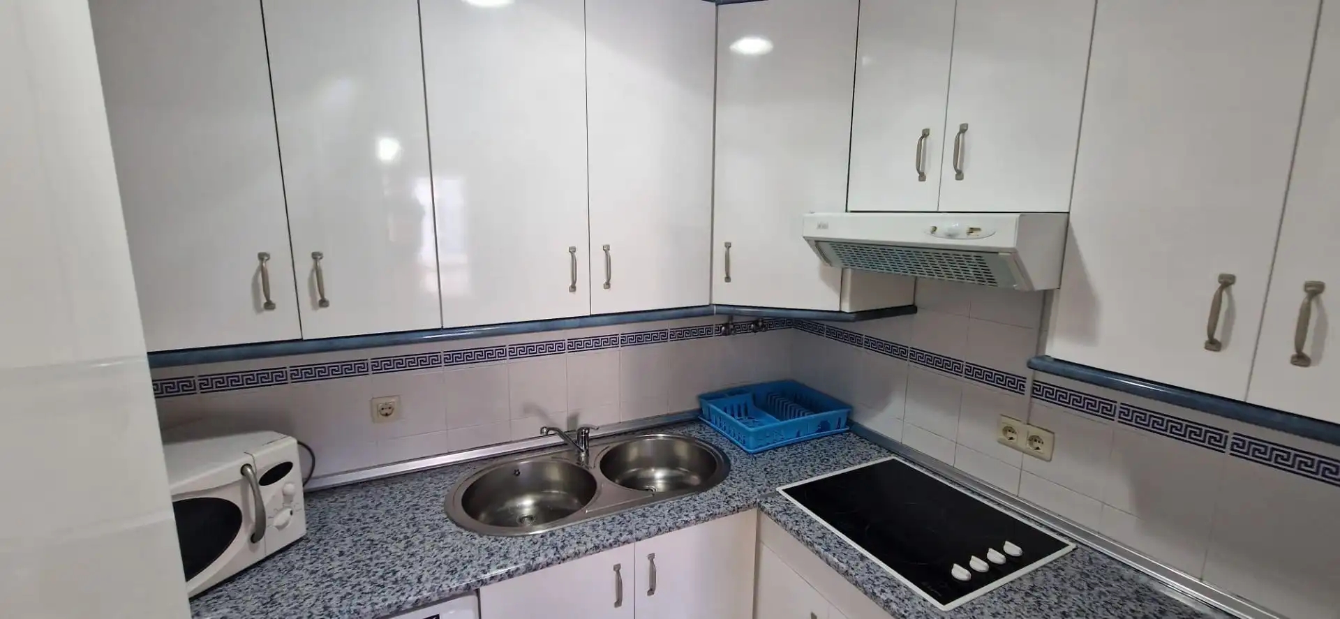Cuina de Apartament de lloguer en El Portil amb Piscina comunitària