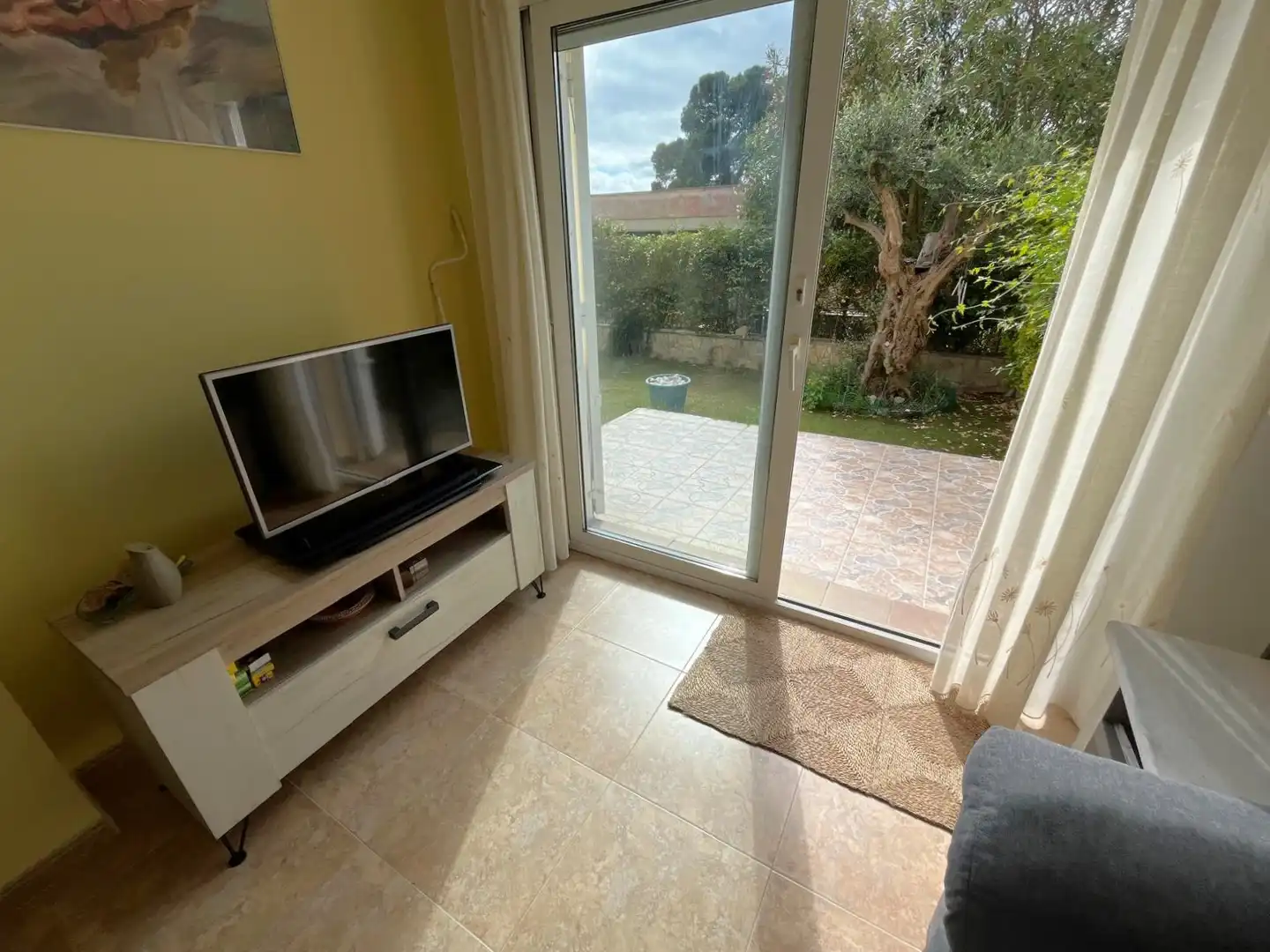 Sala de estar de Planta baja en venta en Castell d'Aro, Platja d'Aro i s'Agaró con Aire acondicionado, Jardín privado y Terraza