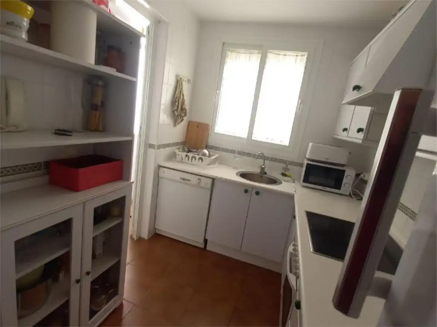 Cuina de Apartament de lloguer en Islantilla amb Jardí privat, Piscina i Moblat