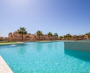 Swimming pool of Planta baja for sale in Torrevieja  with Air Conditioner, Heating and Parquet flooring