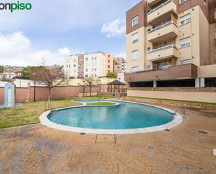 Swimming pool of Flat for sale in  Granada Capital  with Air Conditioner, Heating and Private garden