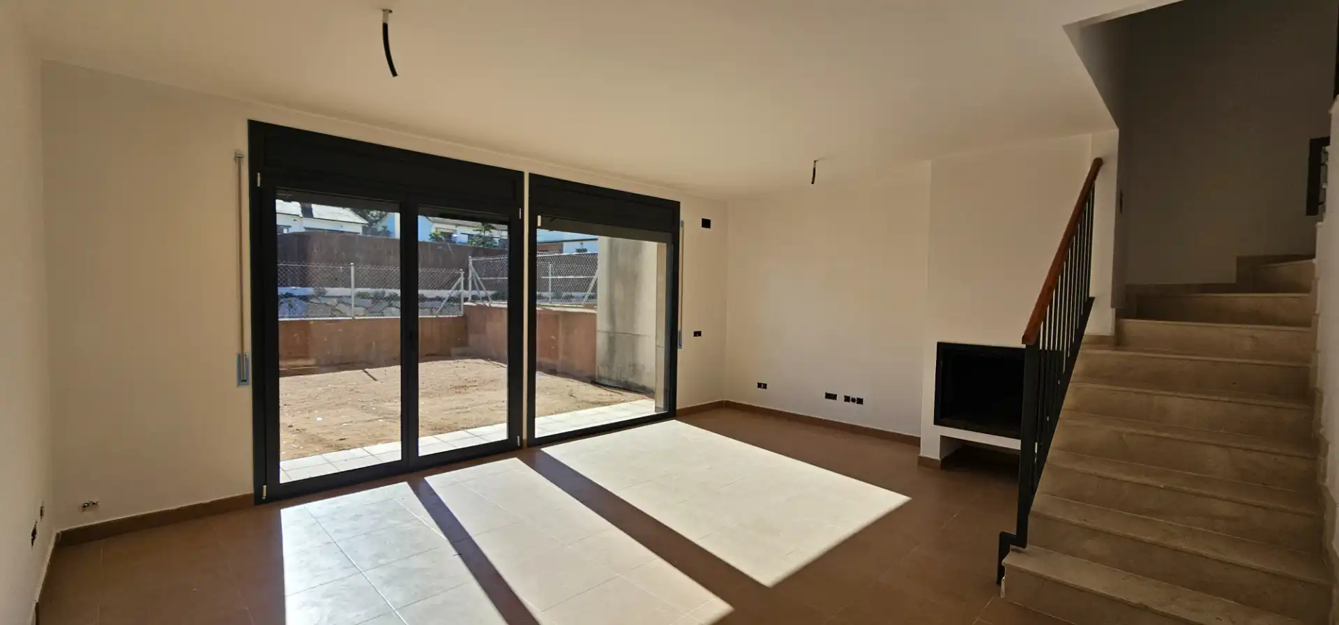 Sala d'estar de Casa adosada en venda en Arbúcies amb Jardí privat, Terrassa i Traster