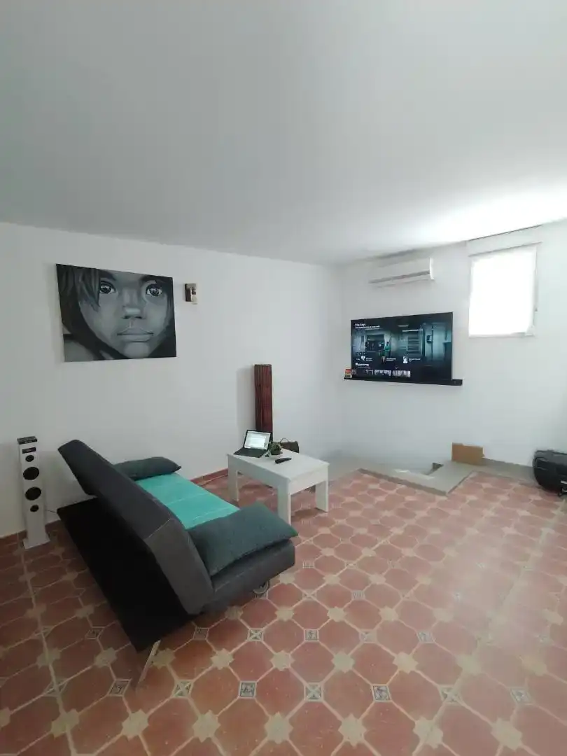 Sala de estar de Casa adosada en venta en Málaga con Aire acondicionado, Parquet y Amueblado