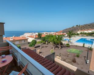 Exterior view of Single-family semi-detached for sale in Santiago del Teide  with Air Conditioner, Terrace and Storage room