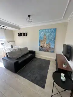 Sala d'estar de Apartament en venda en León Capital  amb Calefacció, Parquet i Terrassa