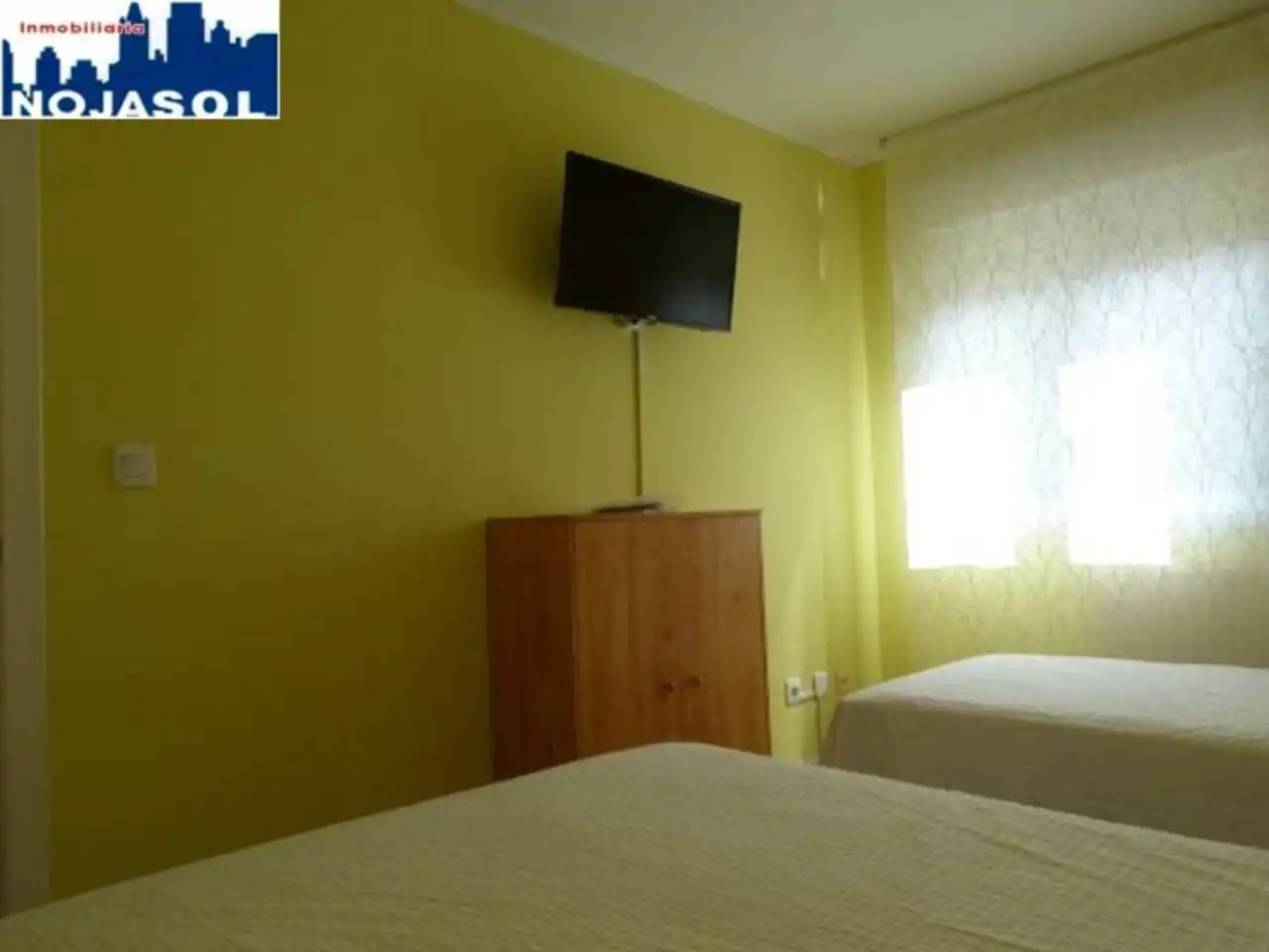 Dormitori de Apartament de lloguer en Arnuero amb Calefacció, Jardí privat i Terrassa