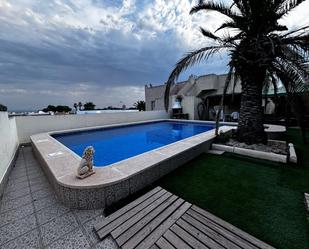 Swimming pool of Single-family semi-detached for sale in Torrevieja  with Air Conditioner, Terrace and Storage room