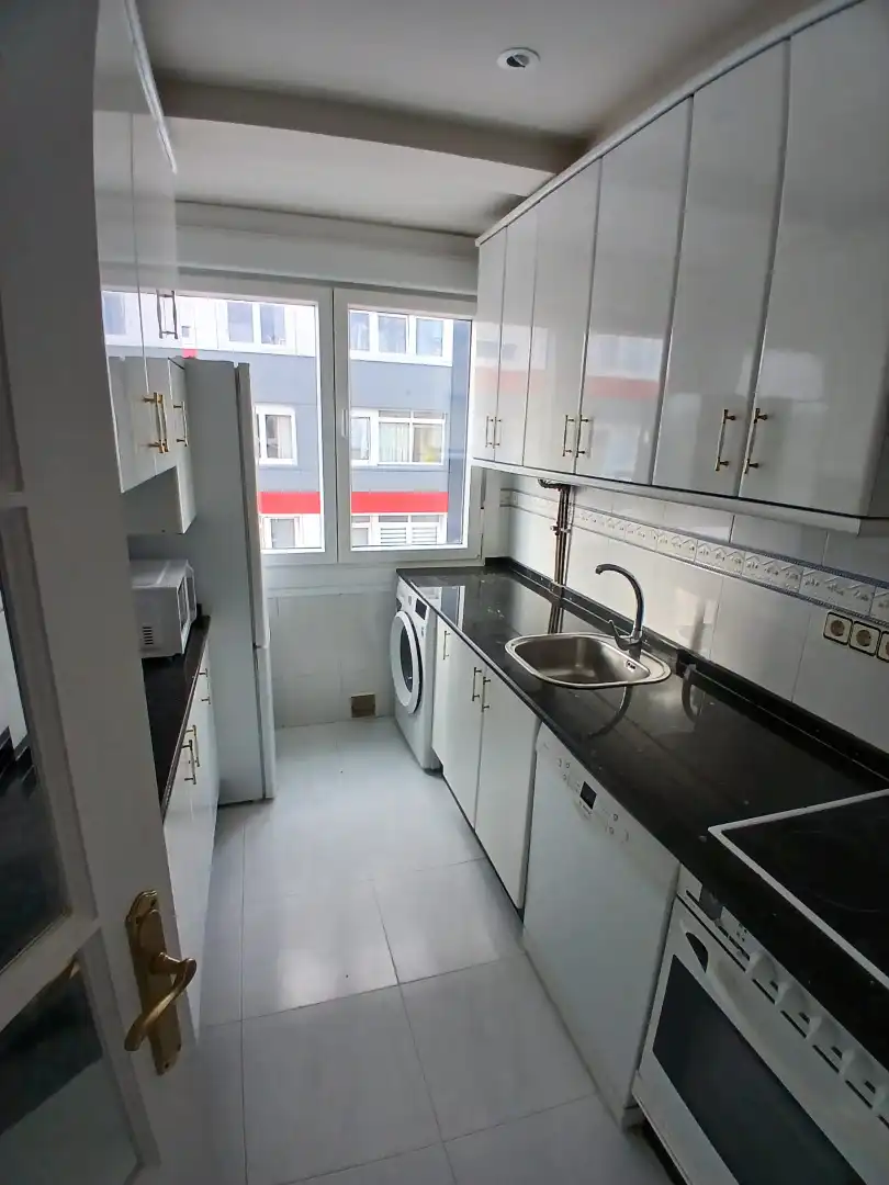 Kitchen of Flat for share in Os Mallos