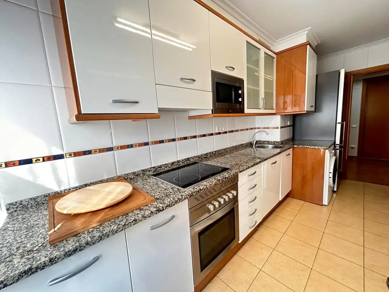 Kitchen of Flat for rent in Gijón   with Heating, Terrace and Storage room