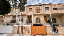 Vista exterior de Casa adosada en venda en Roquetas de Mar amb Aire condicionat, Calefacció i Balcó