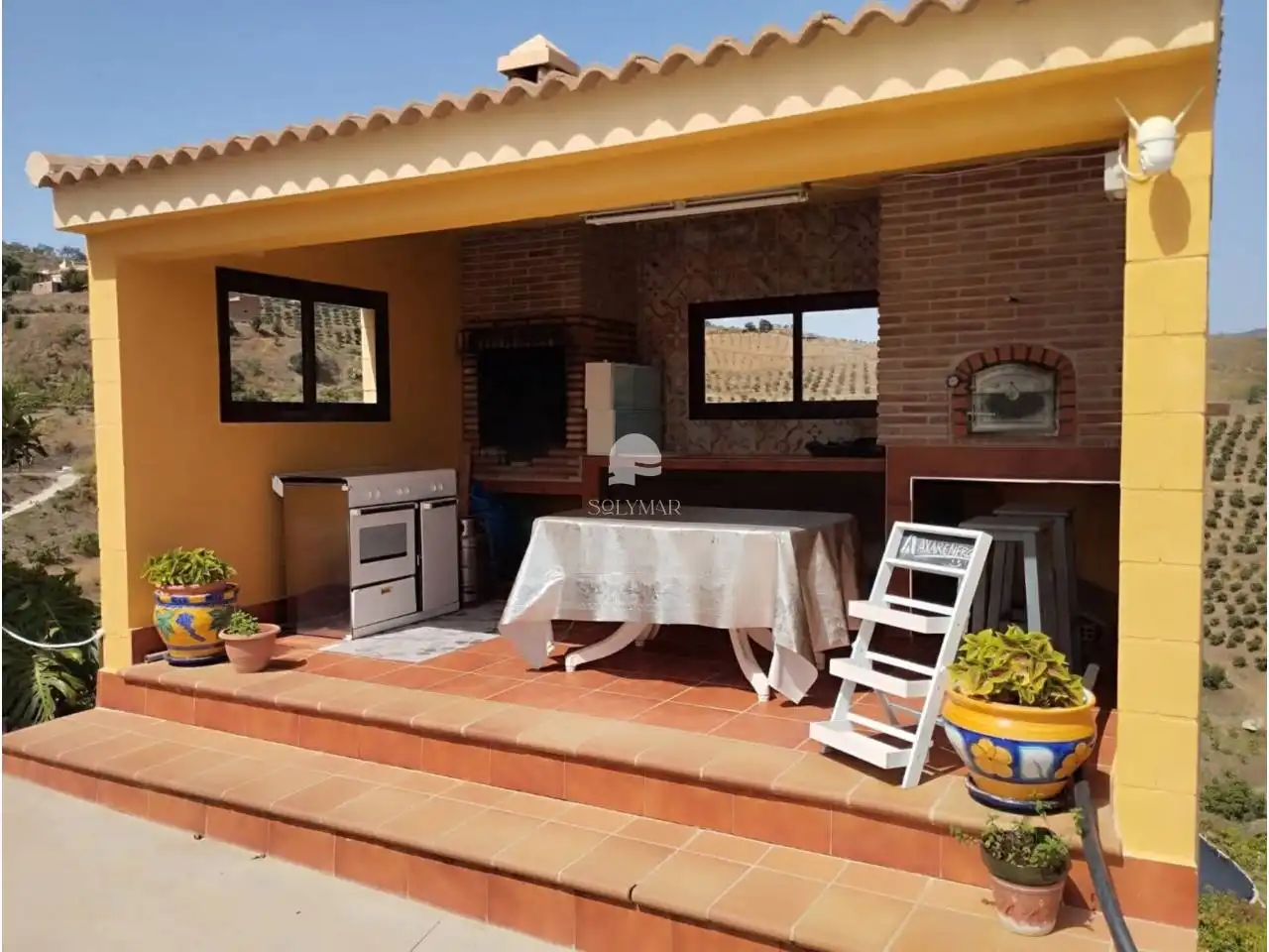 Terraza de Finca rústica de alquiler en Vélez-Málaga con Aire acondicionado, Jardín privado y Terraza