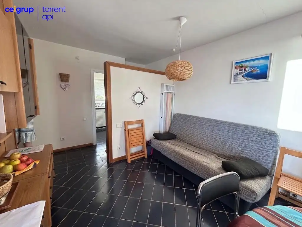 Living room of Flat for sale in L'Escala  with Terrace, Swimming Pool and Furnished
