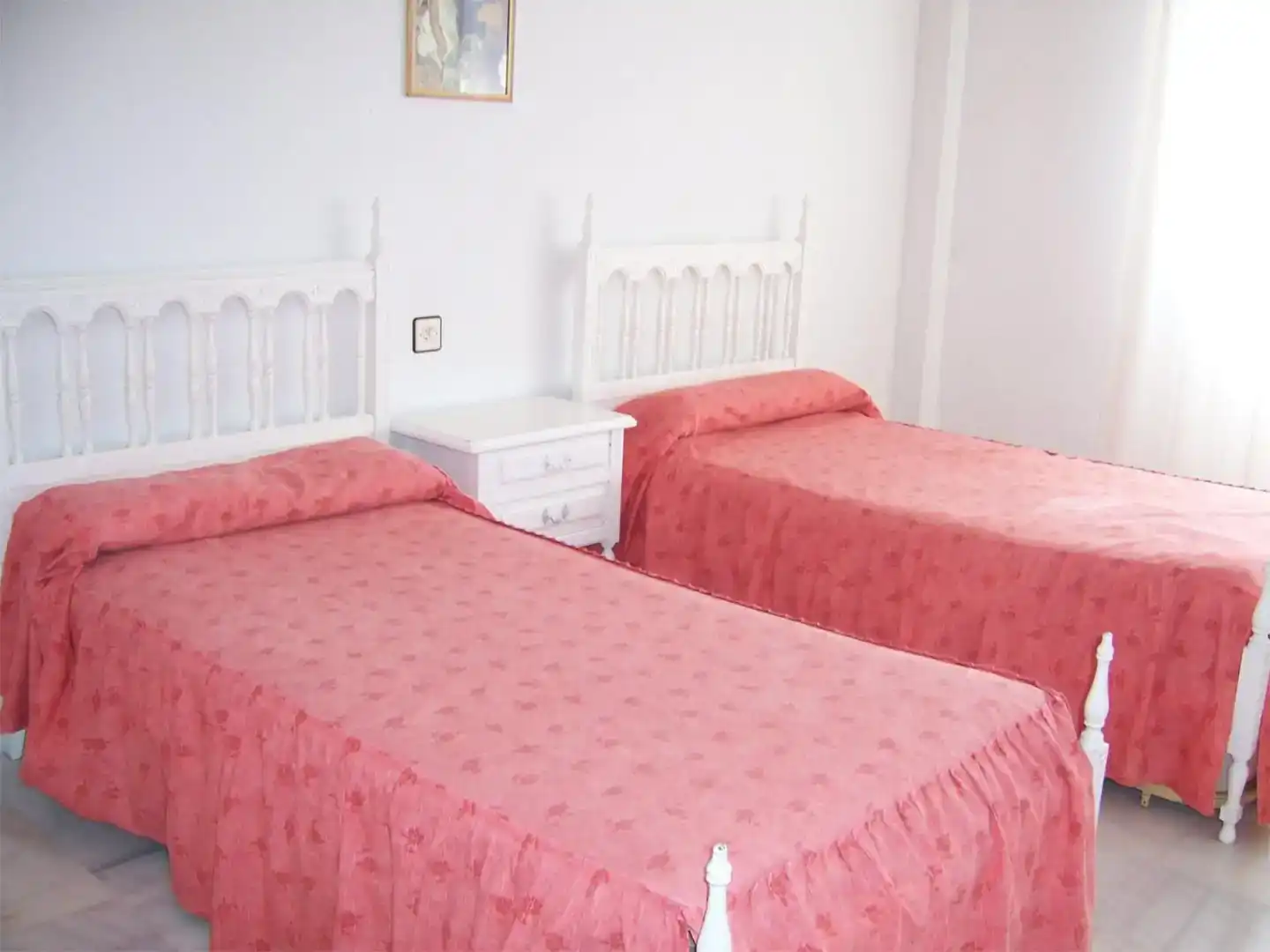 Dormitori de Casa adosada de lloguer en Salobreña amb Aire condicionat, Jardí privat i Traster