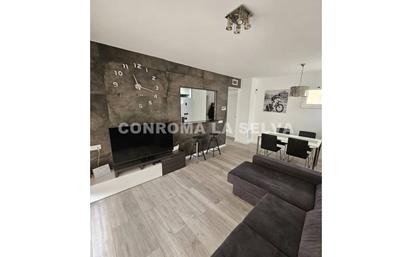 Living room of Flat for sale in Lloret de Mar  with Heating, Private garden and Parquet flooring