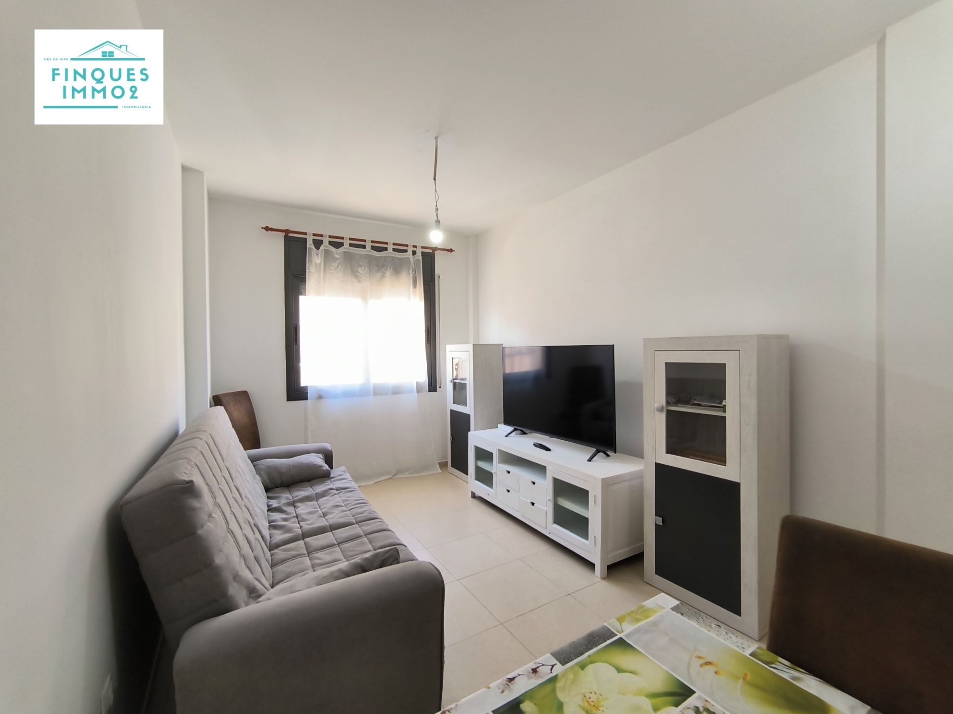 Sala d'estar de Pis en venda en L'Aldea amb Moblat i Balcó