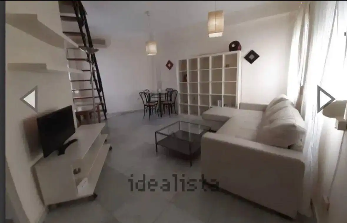 Sala d'estar de Dúplex de lloguer en Sevilla amb Aire condicionat i Moblat