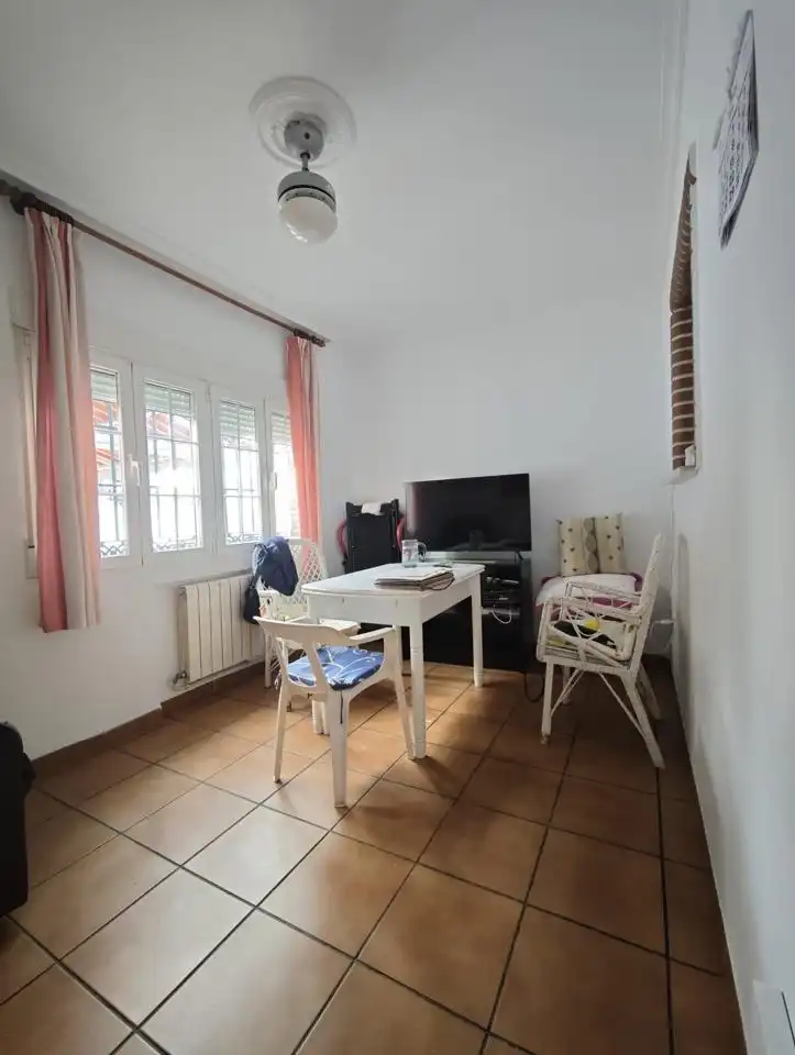 Sala de estar de Casa adosada en venta en El Álamo con Aire acondicionado, Calefacción y Jardín privado