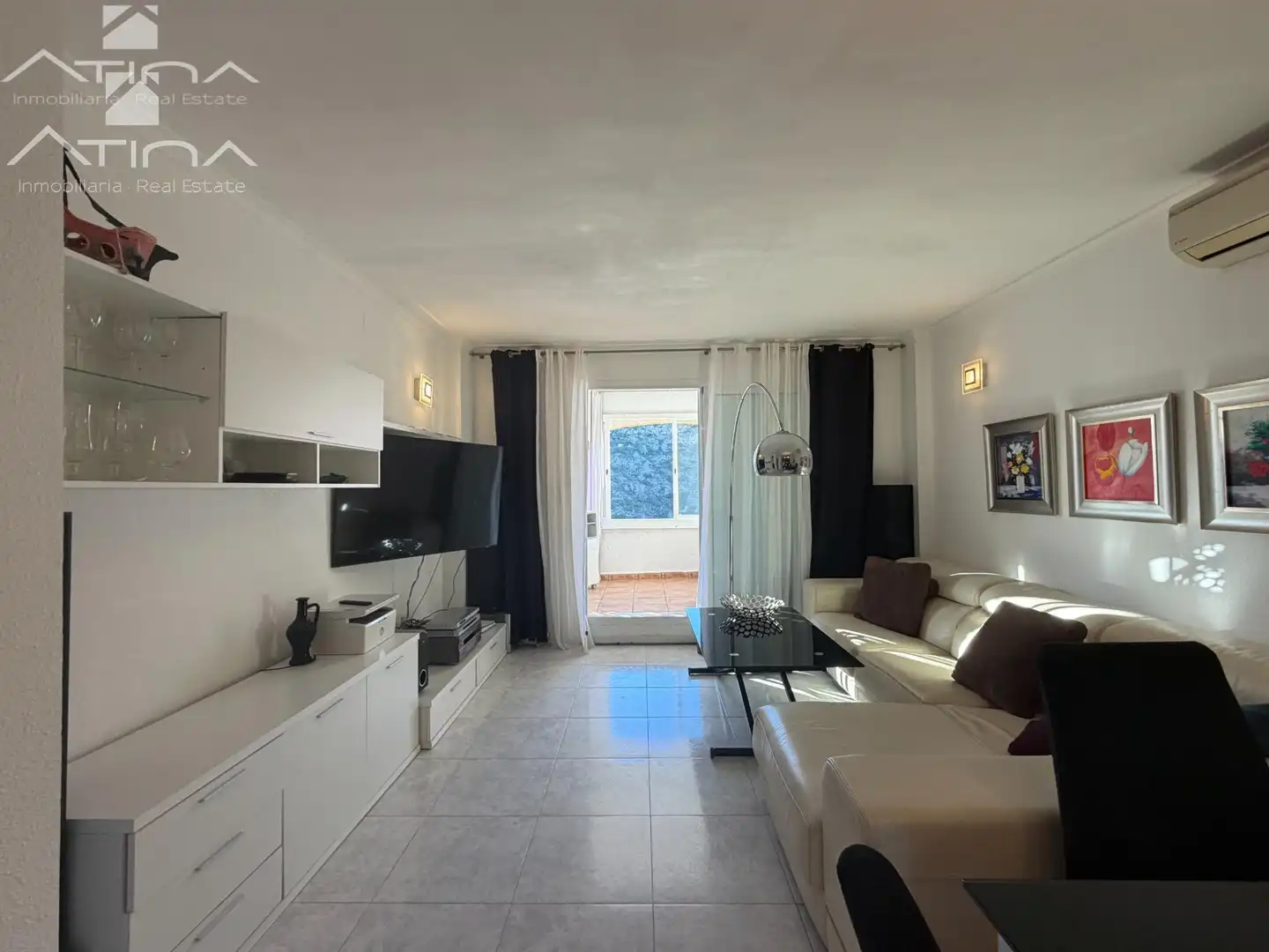 Sala d'estar de Apartament en venda en Benitachell / El Poble Nou de Benitatxell amb Aire condicionat, Jardí privat i Terrassa