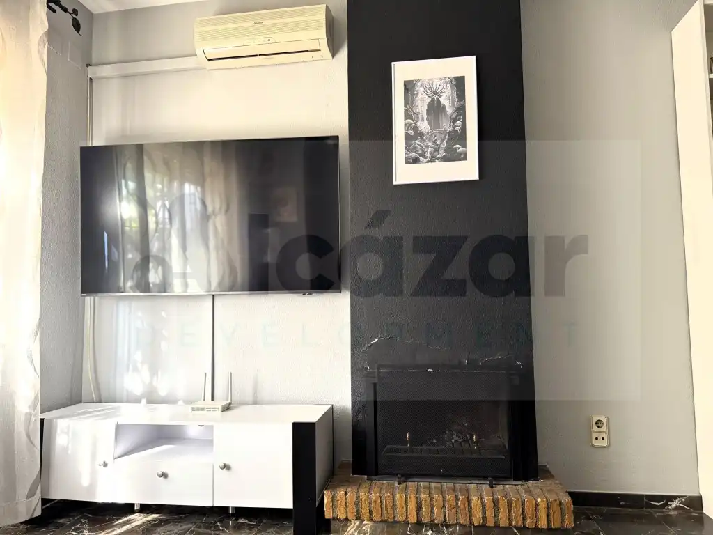 Sala de estar de Casa adosada en venta en Mairena del Alcor con Aire acondicionado y Terraza