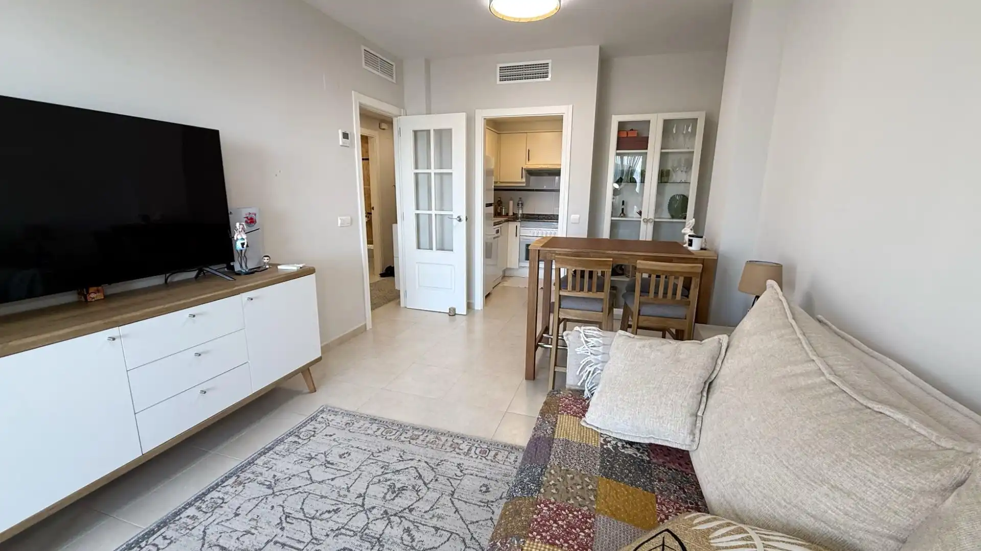 Sala d'estar de Apartament en venda en Calpe / Calp amb Aire condicionat, Calefacció i Jardí privat