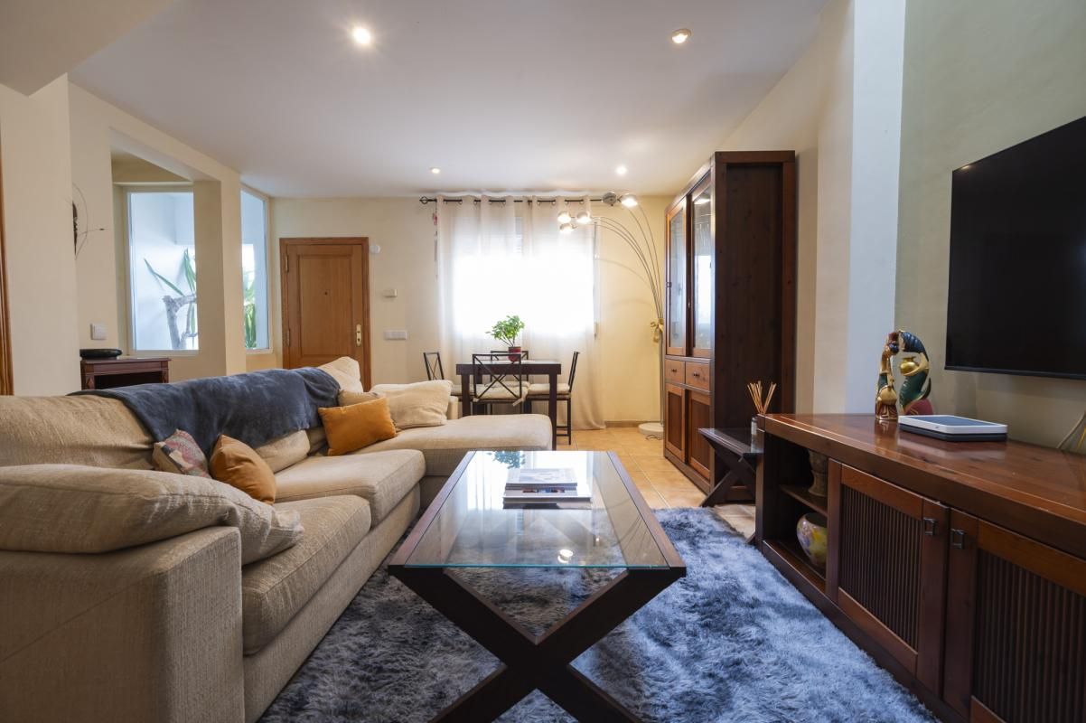 Sala de estar de Casa adosada en venta en Sant Antoni de Portmany con Aire acondicionado, Calefacción y Jardín privado