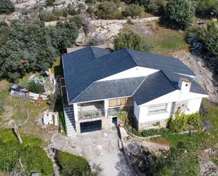 Vista exterior de Casa o xalet en venda en La Cabrera amb Calefacció, Jardí privat i Terrassa