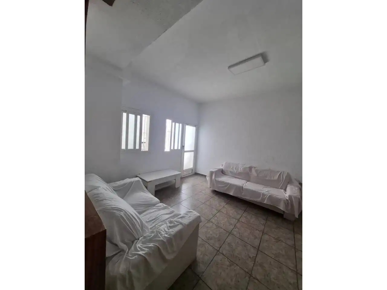 Sala de estar de Casa adosada en venta en Roquetas de Mar con Aire acondicionado y Terraza