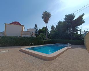 Swimming pool of Single-family semi-detached for sale in Torrevieja  with Air Conditioner, Private garden and Terrace