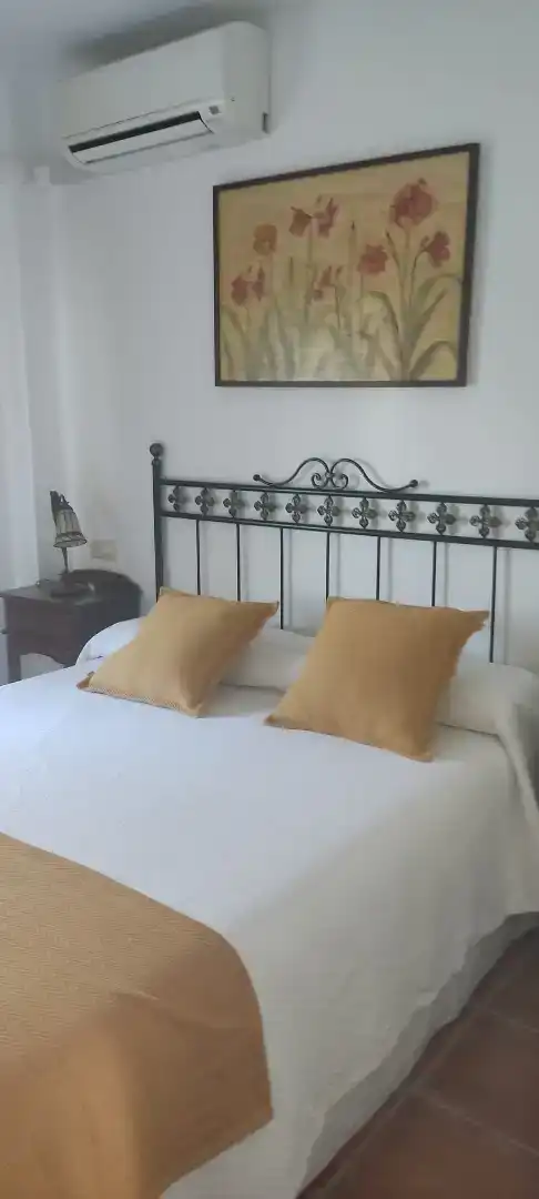 Dormitori de Casa adosada de lloguer en Islantilla amb Aire condicionat, Piscina i Balcó