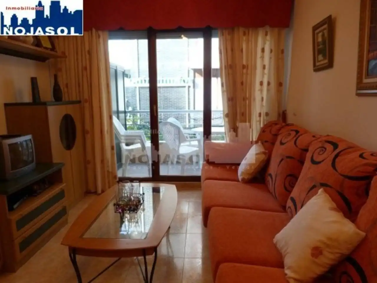 Sala d'estar de Apartament de lloguer en Noja amb Calefacció, Jardí privat i Terrassa