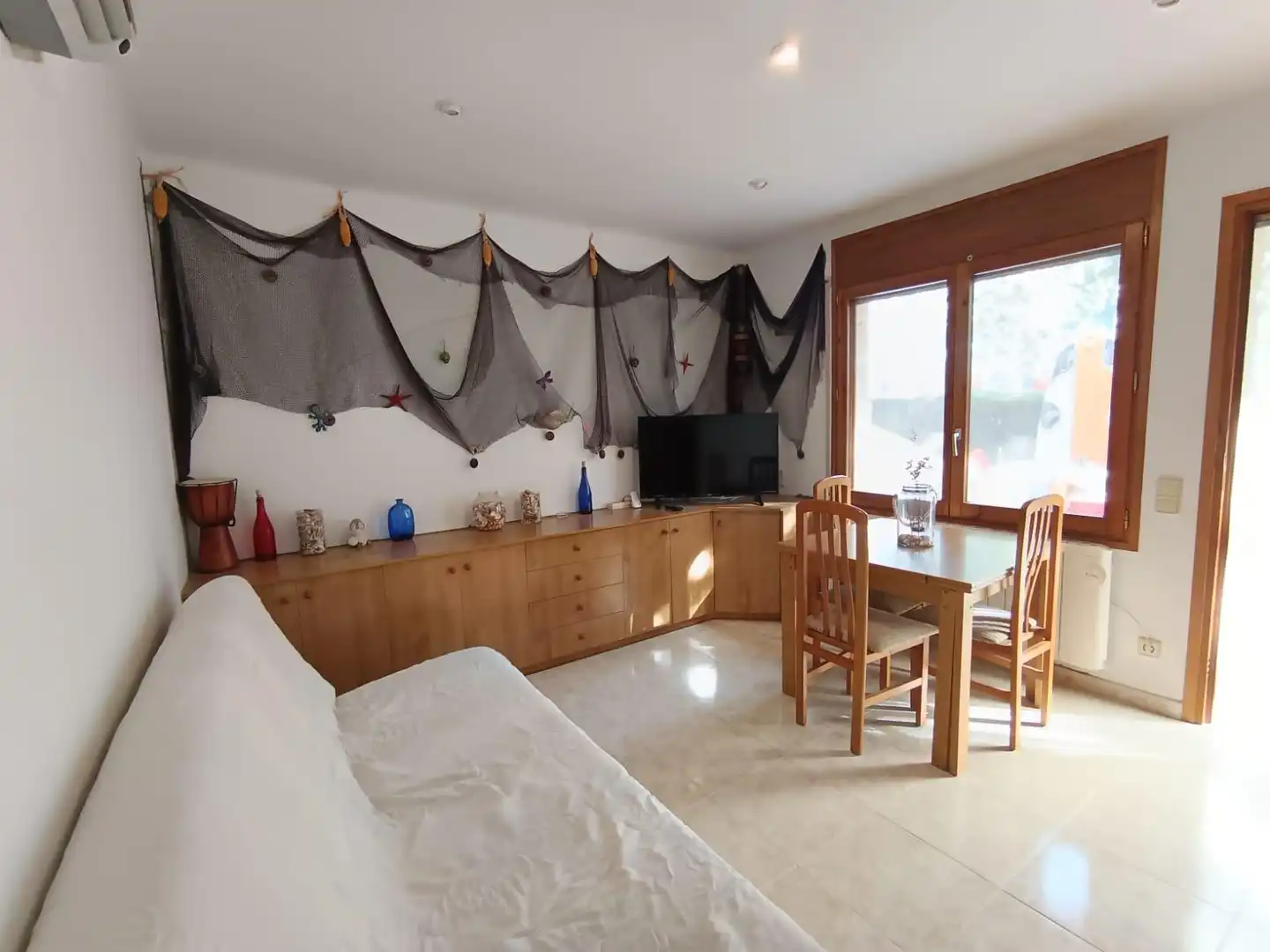 Sala de estar de Apartamento en venta en Castell d'Aro, Platja d'Aro i s'Agaró con Aire acondicionado, Calefacción y Terraza