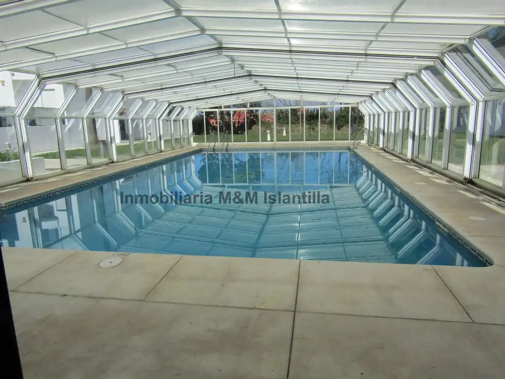 Piscina de Casa adosada en venta en Islantilla con Terraza, Trastero y Amueblado