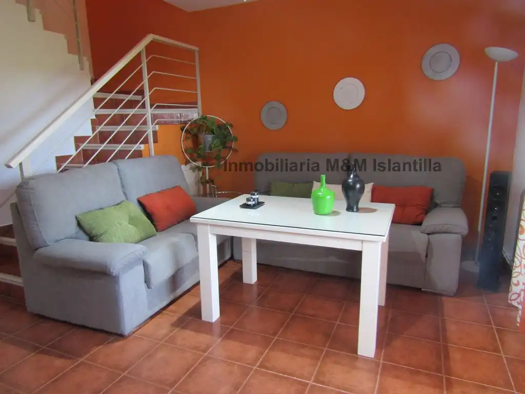 Sala de estar de Casa adosada en venta en Islantilla con Jardín privado, Terraza y Amueblado