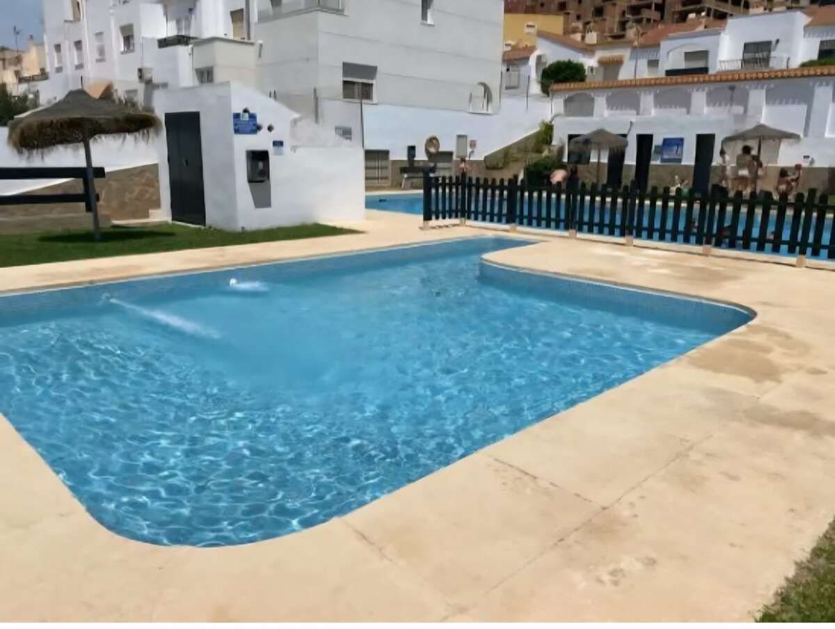 Swimming pool of Duplex for sale in Roquetas de Mar  with Air Conditioner, Storage room and Furnished