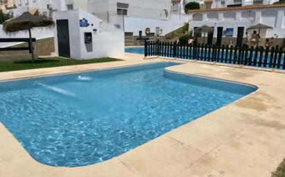 Swimming pool of Duplex for sale in Roquetas de Mar  with Air Conditioner, Storage room and Furnished