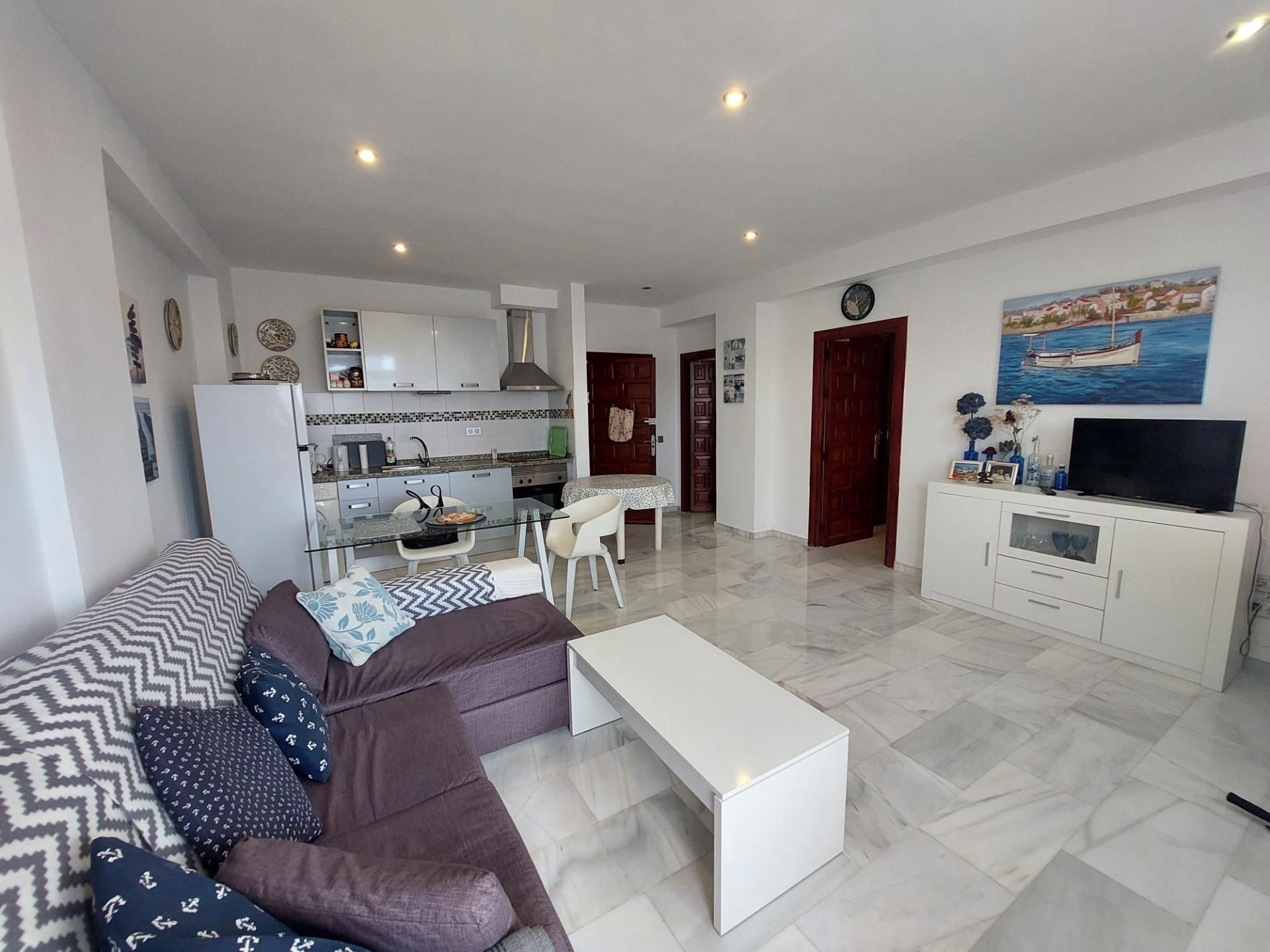 Sala d'estar de Apartament en venda en Roquetas de Mar amb Aire condicionat, Jardí privat i Terrassa
