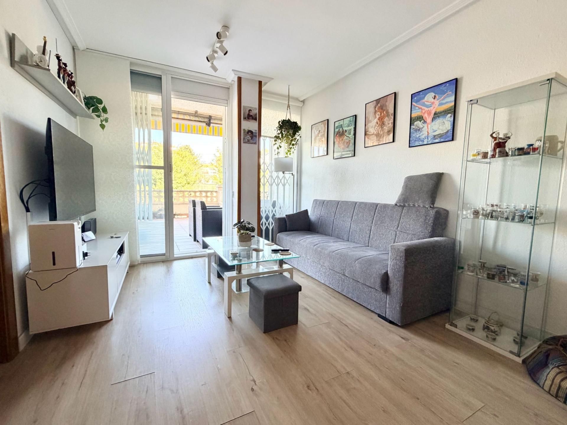 Living room of Planta baja for sale in Calafell  with Air Conditioner and Storage room