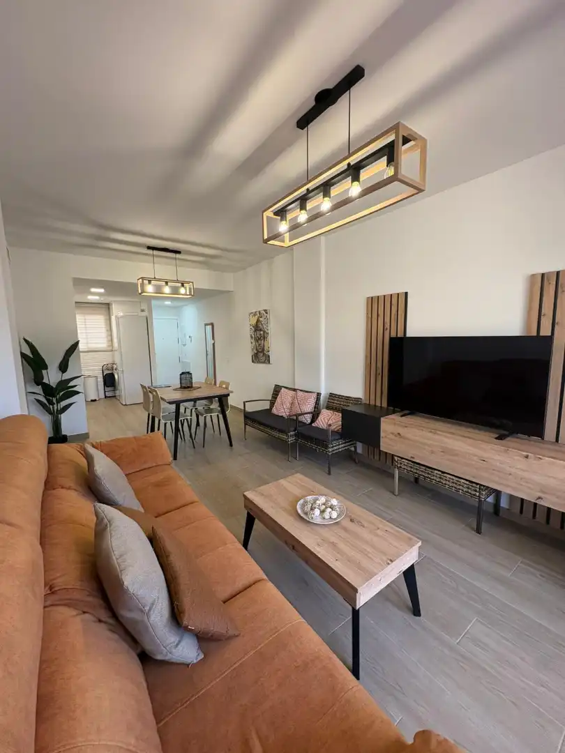 Wohnzimmer von Wohnung zum Verkauf in Chipiona mit Klimaanlage, Heizung und Privatgarten