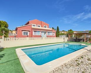 Vista exterior de Casa o xalet en venda en Busot amb Jardí privat, Terrassa i Traster
