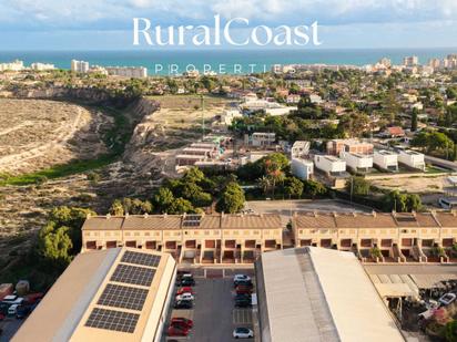 Exterior view of Single-family semi-detached for sale in Sant Joan d'Alacant  with Parquet flooring, Storage room and Swimming Pool