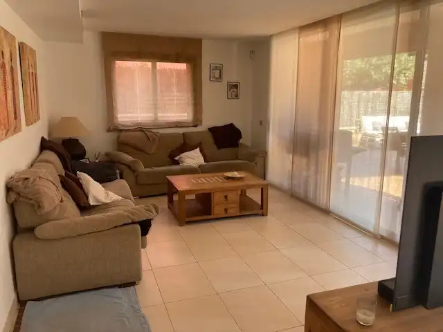 Sala de estar de Casa adosada en venta en Palamós con Aire acondicionado, Terraza y Piscina