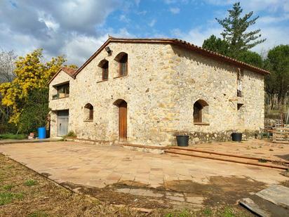 Vista exterior de Finca rústica en venda en Breda amb Calefacció, Jardí privat i Traster