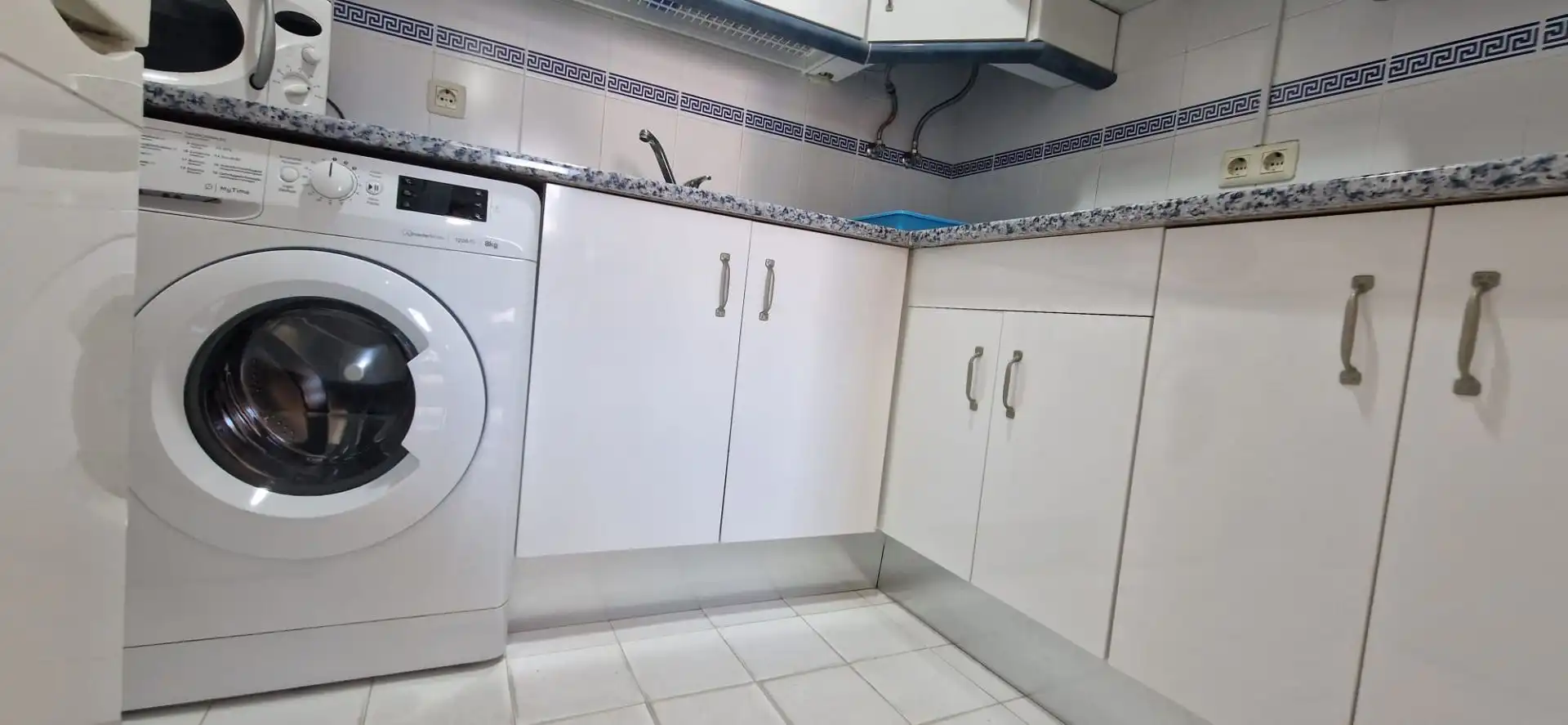 Cuina de Apartament de lloguer en El Portil amb Piscina comunitària
